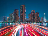 Long Exposure Of Night Time City And Boat Lights